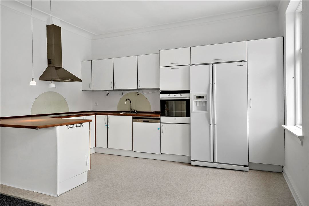 Til salg hos EDC Ejen­doms­grup­pen Struer: 2-familievilla i bymidten