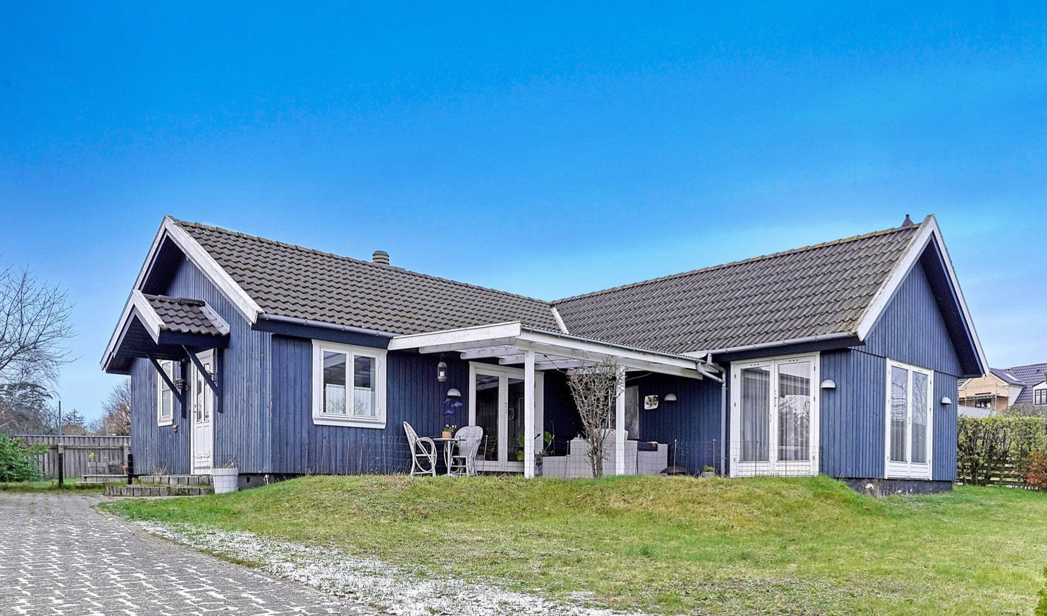 Til salg hos Estate Morten Friis: Hyggeligt træhus med moderne indretning og central beliggenhed