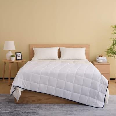 Tilbud på Nordis tyngdedyne hos Min Købmand Øster Bjerregrav: Oplev ro og bedre søvn til kun 249,95 kr.